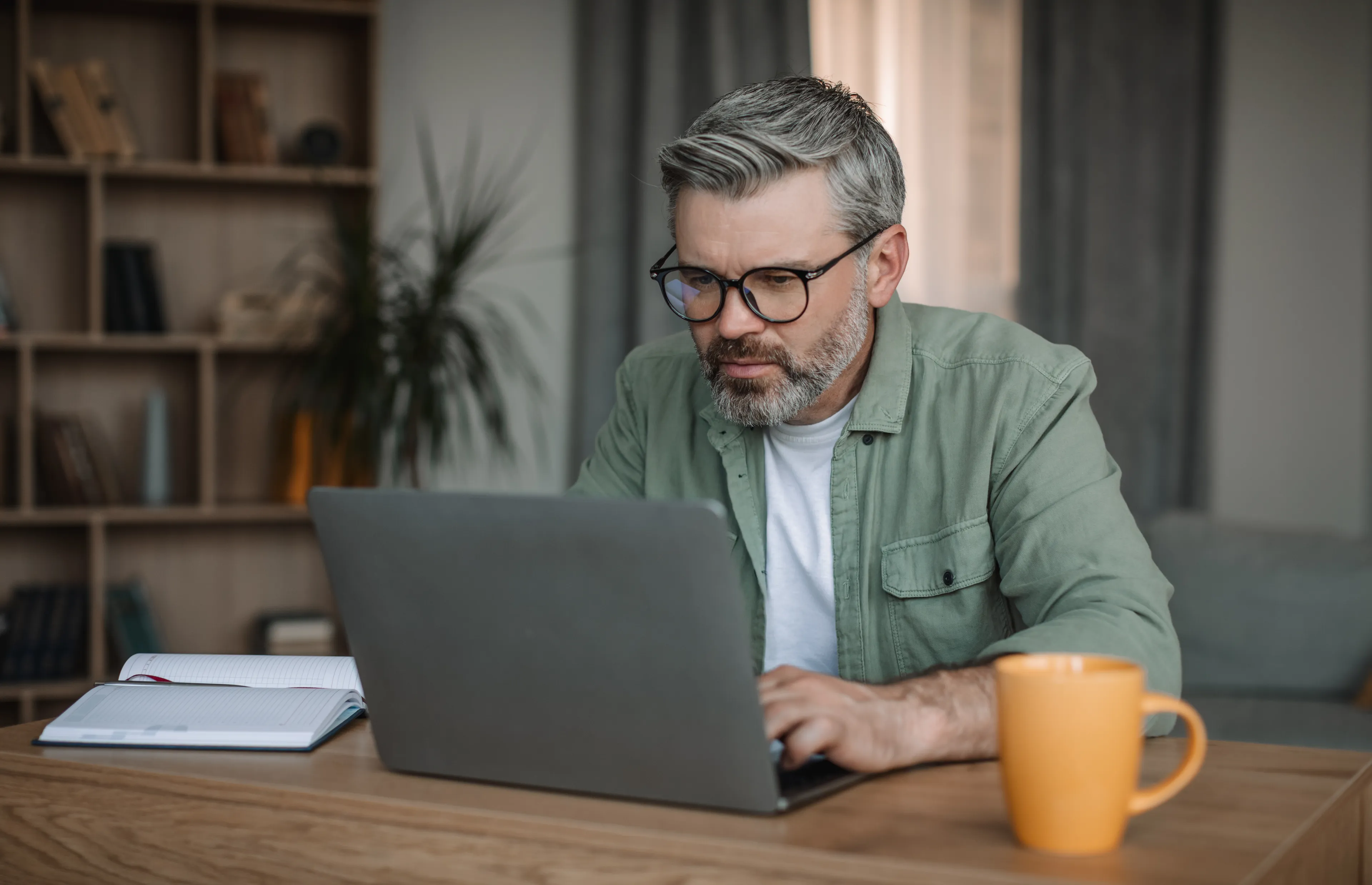 https://mr3.homeflow-assets.co.uk/files/media/image/0000/0000/23cc4a88051d7ef729bf55c6118722b3/SEQfocused-man-working-on-laptop-at-home-office-2026-09-22-02-52-50-utc.jpg