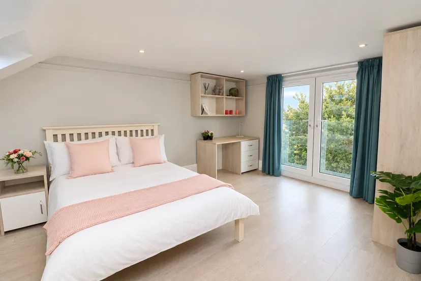 Bright-Blush-Bedroom-with-Balcony-Views.png